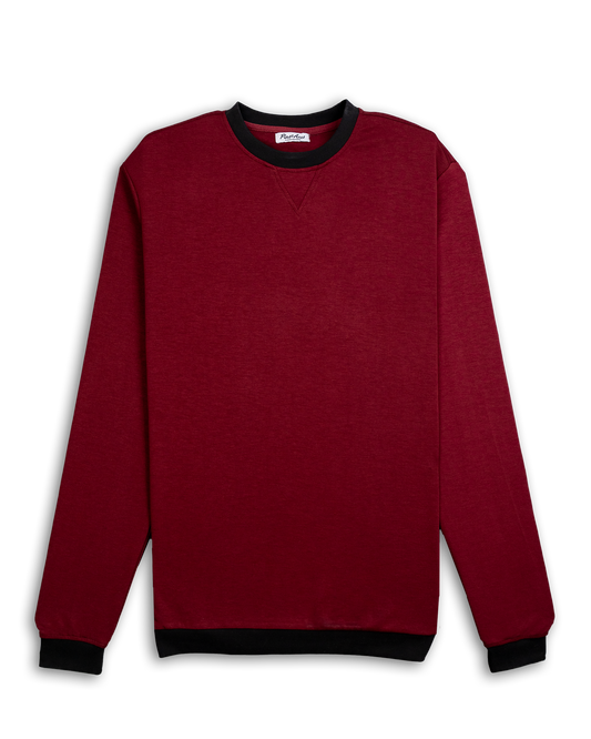 Red crewneck sweatshirt with black collar and cuffs, labeled Player Preferred™ Merlot, displayed against a black background.