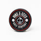 Black Pop Out Medallion Ball Marker, showcasing a sleek design and compact size for easy use on the golf course.