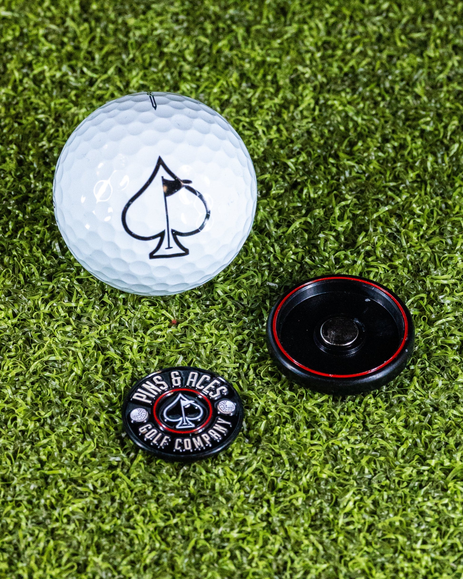 Pop Out Medallion Ball Marker in Black, featuring a sleek design and convenient pop-out mechanism for easy use.