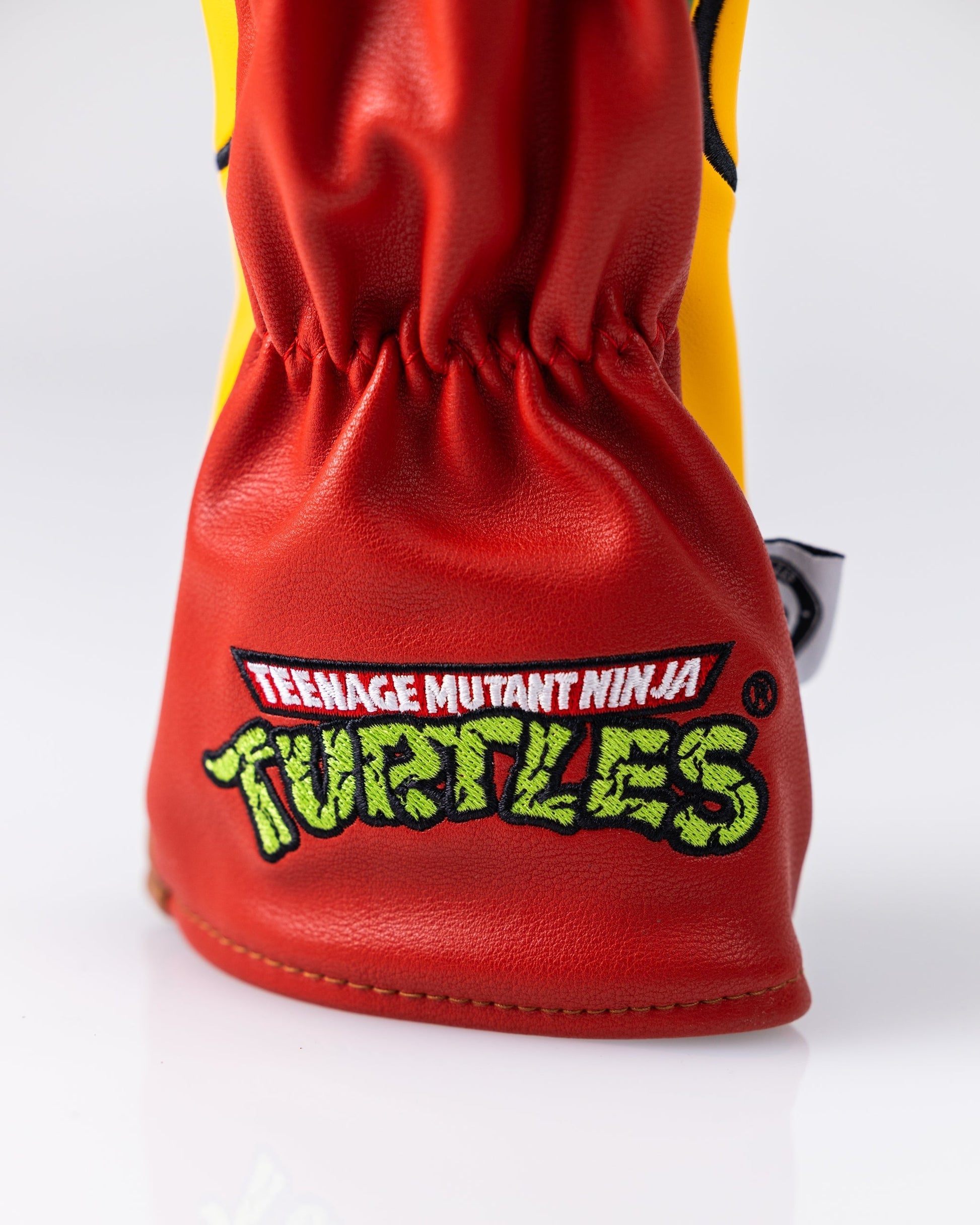 TMNT Raphael Hybrid Golf Club Cover featuring a vibrant design of the iconic character in a protective cover.