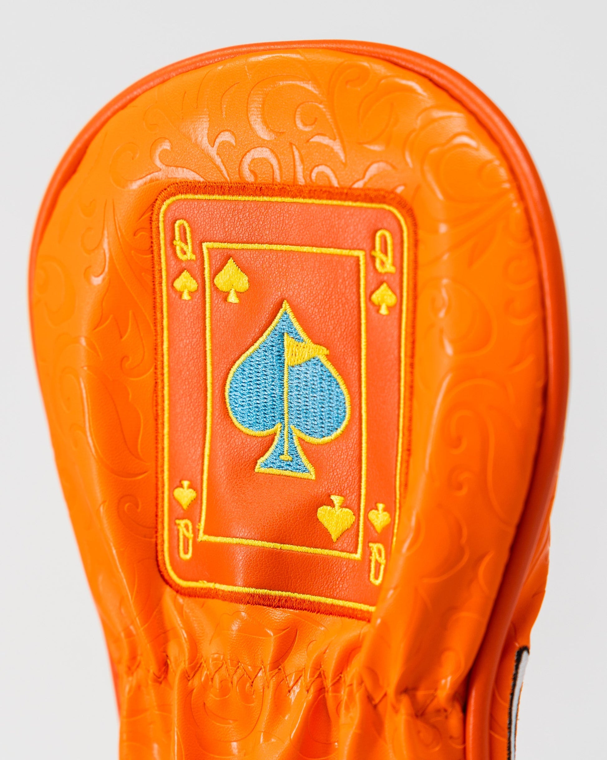 Orange Crush fairway cover featuring a Queen of Spades design, stylishly crafted for golf clubs.