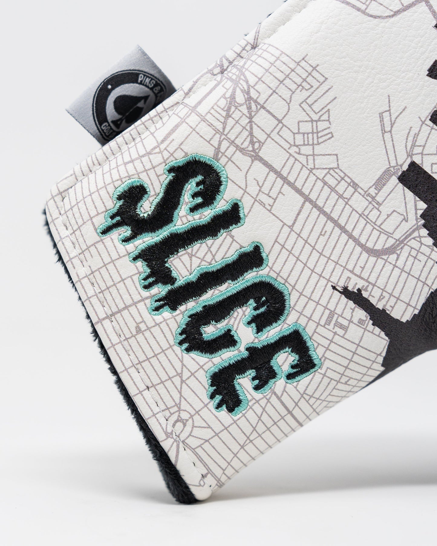 Shady Slice Blade Putter Cover featuring a colorful design and protective fit.