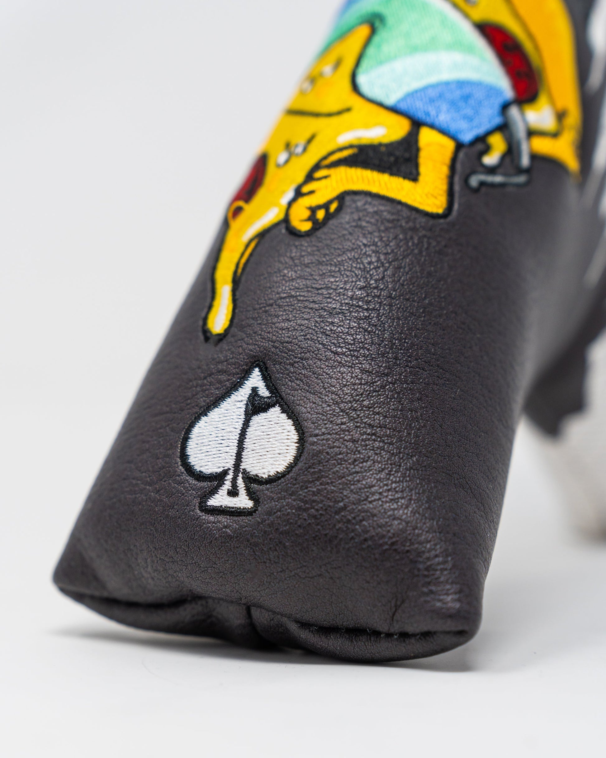 Shady Slice Blade Putter Cover featuring a vibrant design with golf-themed graphics.
