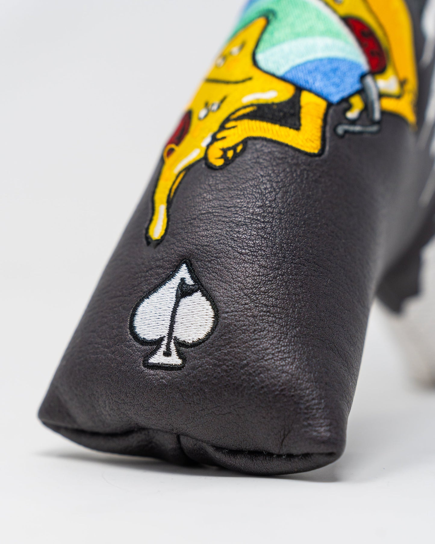 Shady Slice Blade Putter Cover featuring a vibrant design with golf-themed graphics.