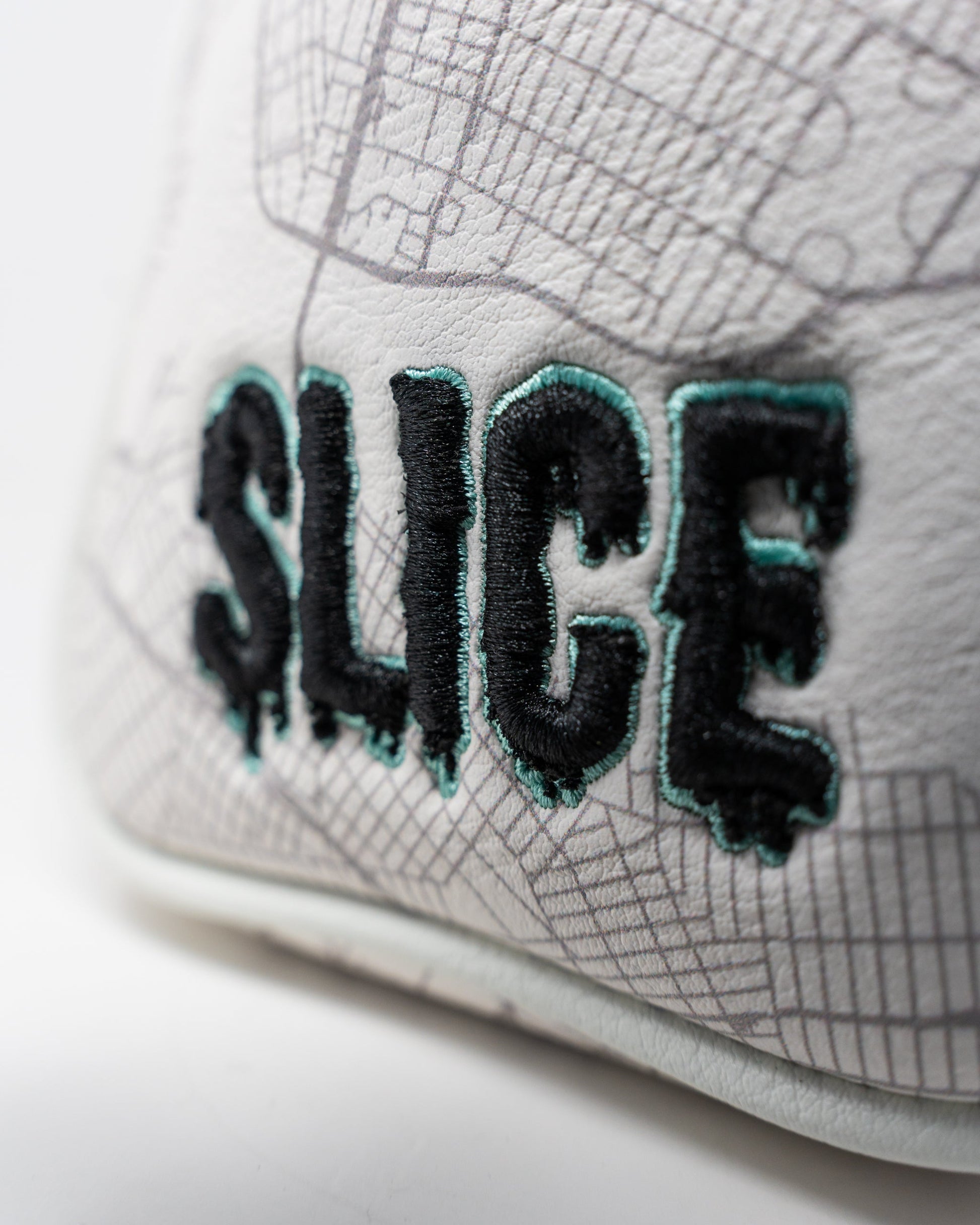 Shady Slice mallet cover featuring a stylish design with green and gray colors, perfect for protecting golf club mallets.