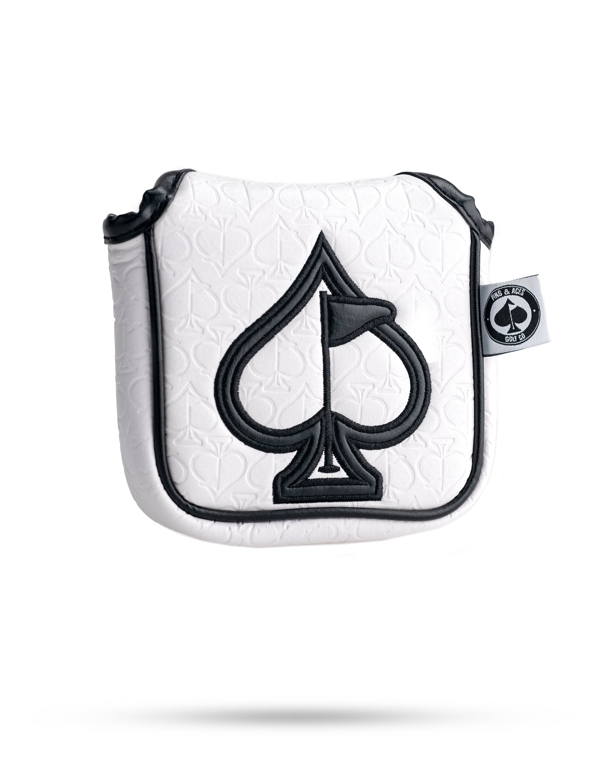 White golf headcover with black spade logo, embossed spade pattern, and bold black trim for standout style.