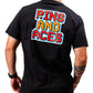 Man wearing a black t-shirt with vibrant 8-bit style graphic text "PINS AND ACES" on the back.