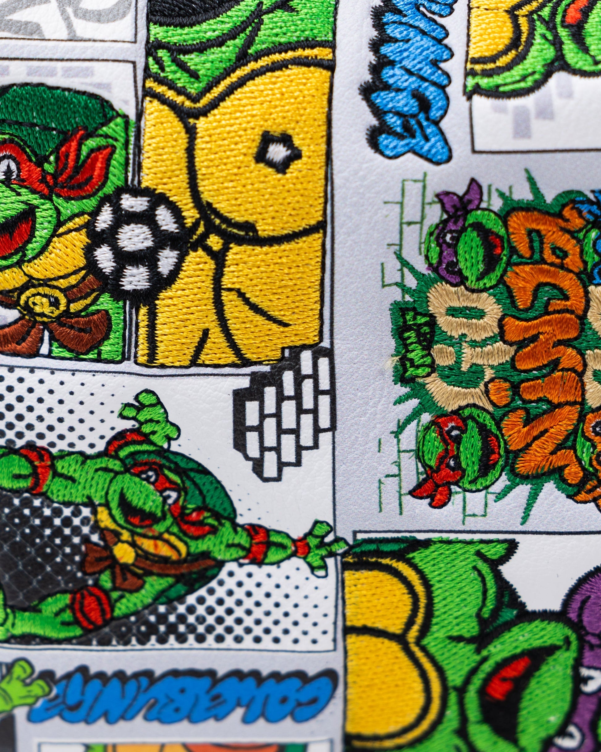 TMNT Comics Mallet Cover featuring colorful graphics of Teenage Mutant Ninja Turtles in action.