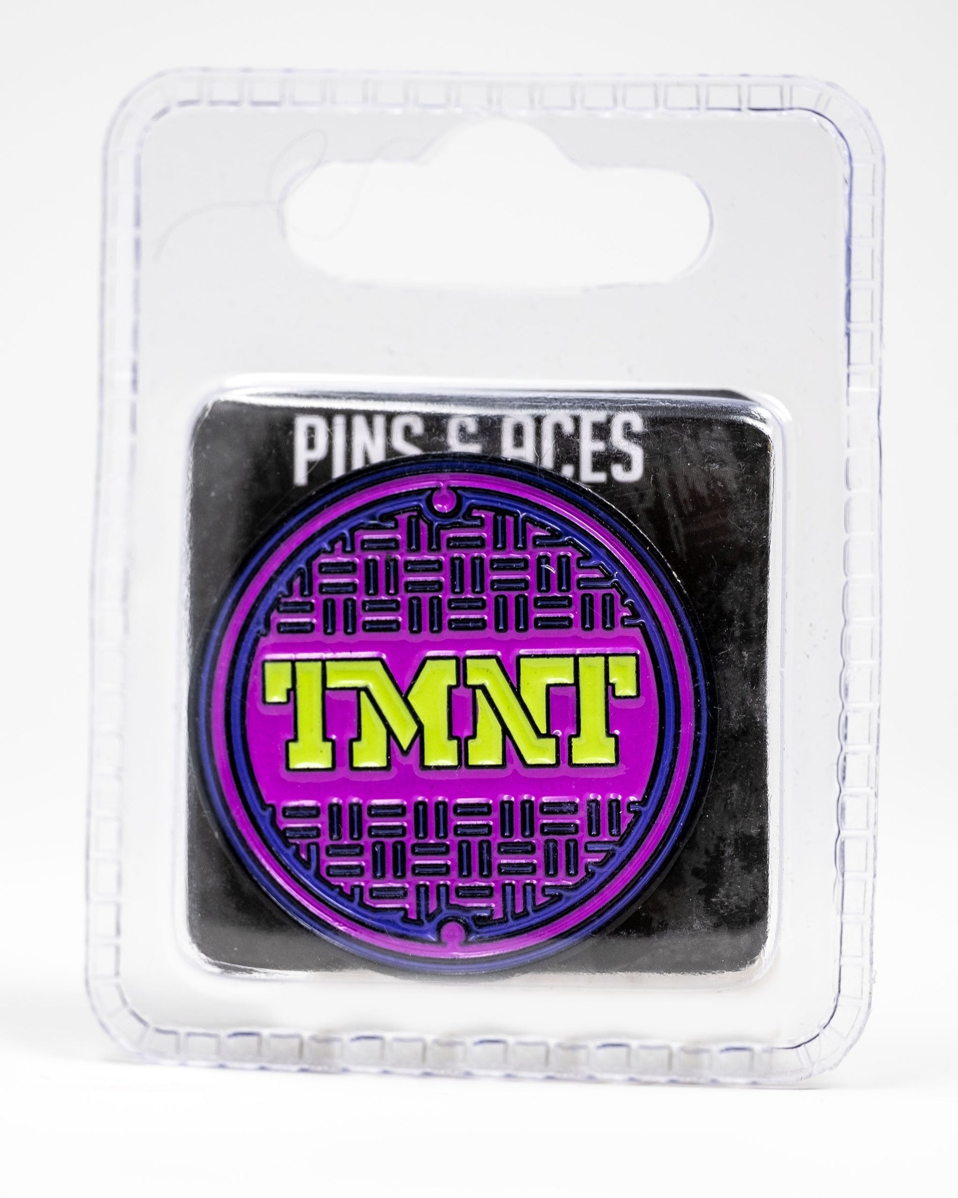 TMNT Sewer Cover Ball Marker featuring colorful Teenage Mutant Ninja Turtles design on a circular, metallic surface.