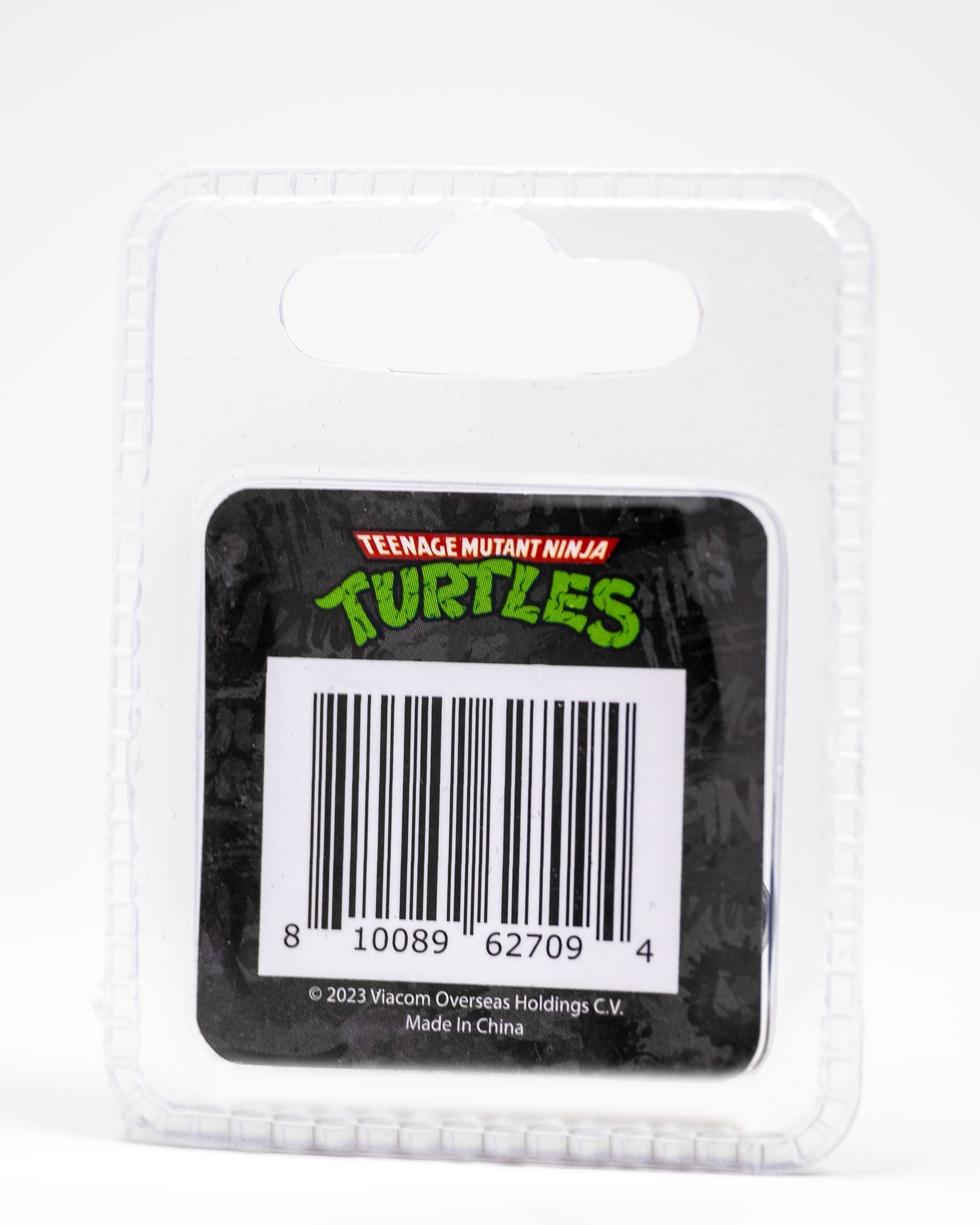 TMNT Shell Shock Ball Marker featuring colorful Teenage Mutant Ninja Turtles graphics on a round, metal design.