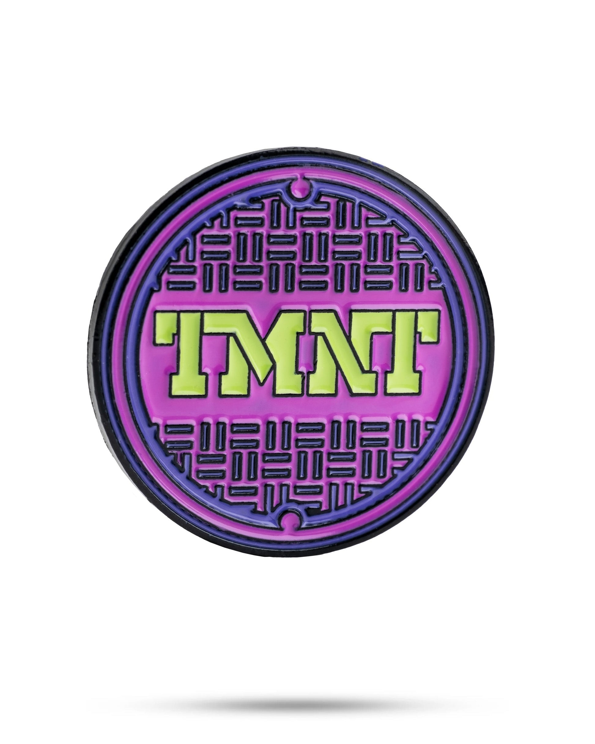 TMNT sewer cover ball marker featuring a colorful design with the Teenage Mutant Ninja Turtles logo.