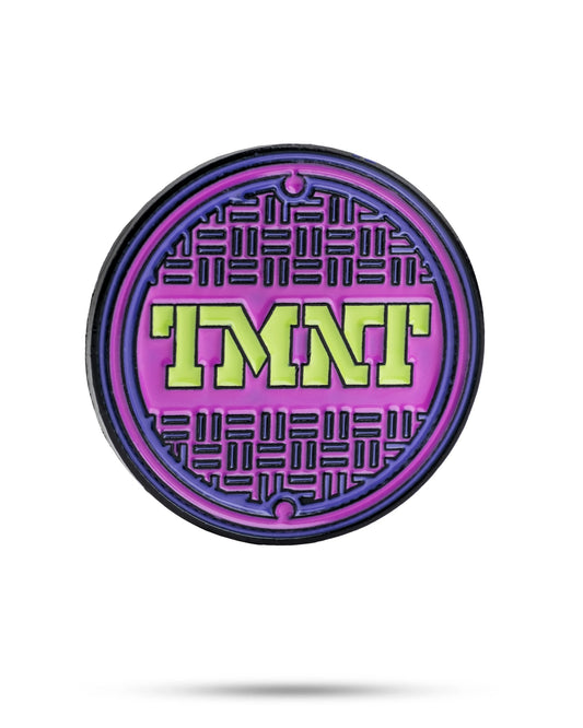 TMNT sewer cover ball marker featuring a colorful design with the Teenage Mutant Ninja Turtles logo.