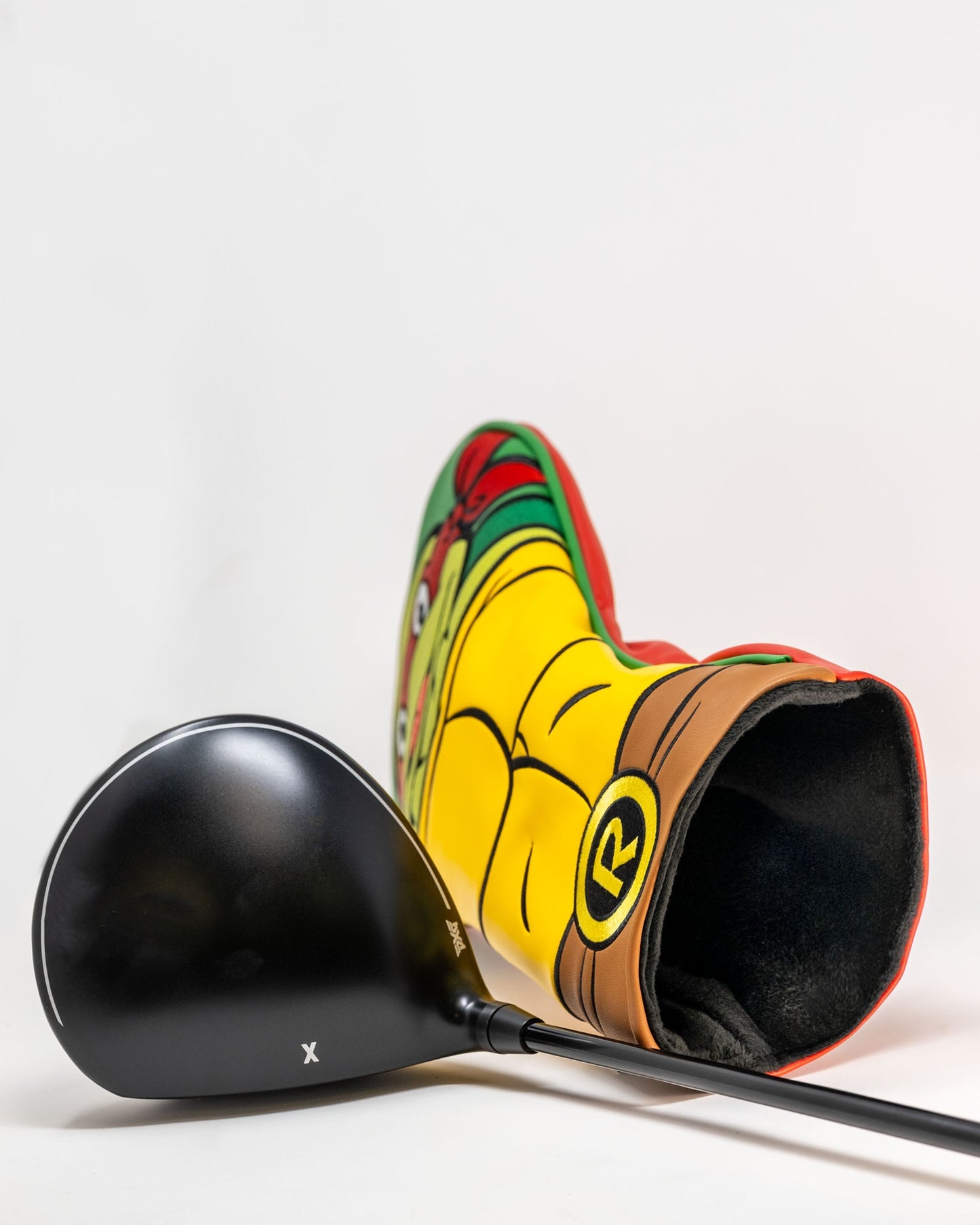 TMNT Raphael driver cover featuring a detailed green and red design with Raphael's signature mask and expression.