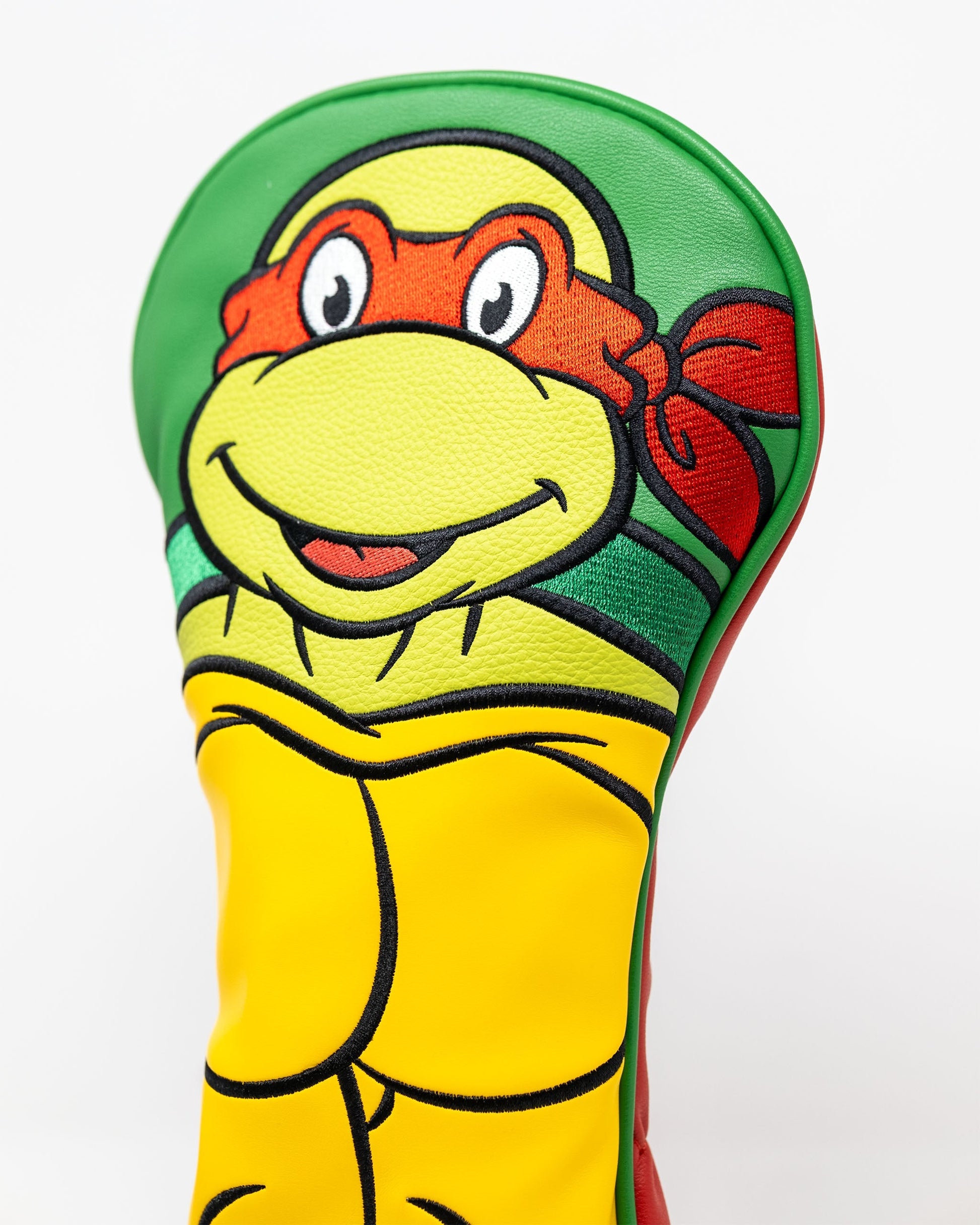 TMNT Raphael golf driver cover featuring a detailed design of the character's face, showcasing vibrant colors and an adjustable fitting.