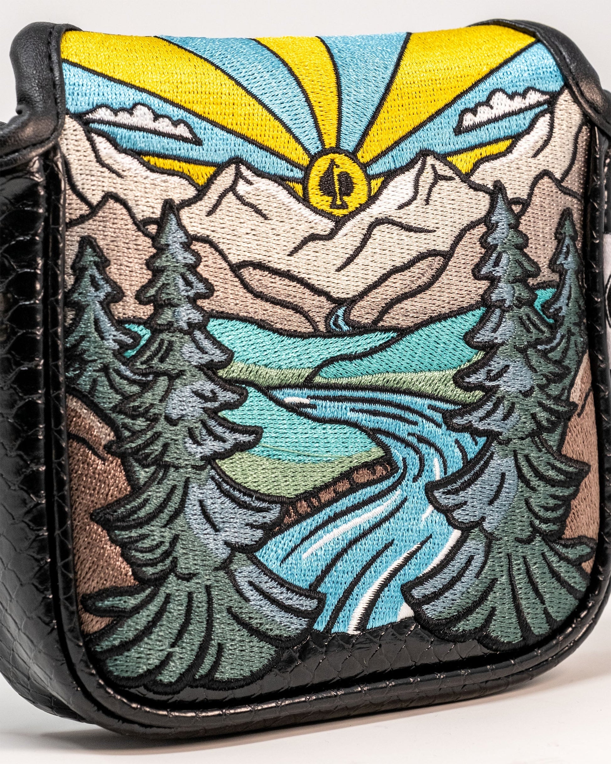 "The Rockies mallet cover featuring a vibrant mountain landscape design, crafted for golf enthusiasts."