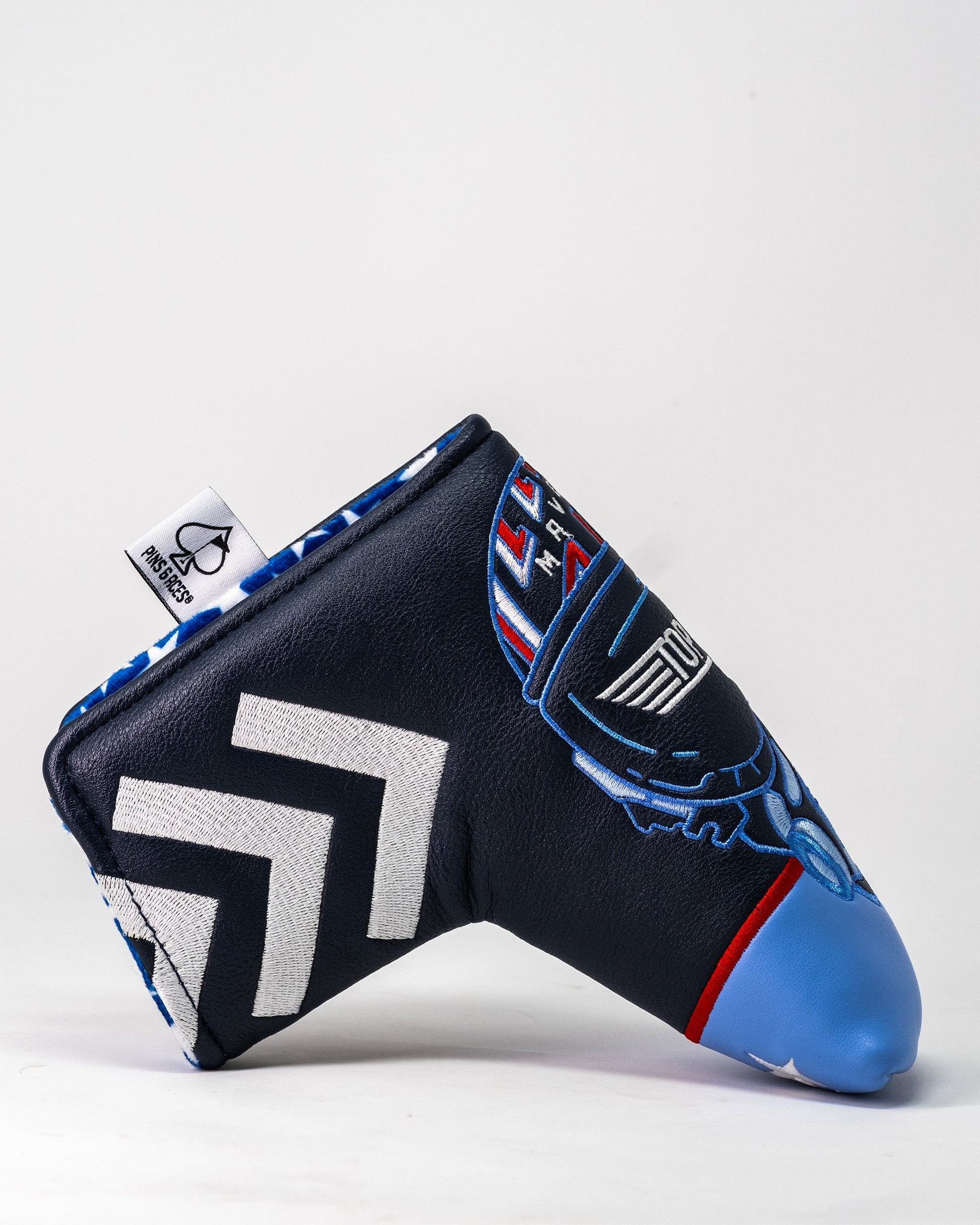 Golf club headcover featuring a Top Gun Maverick aircraft design with blue, black, white, and red embroidered details.