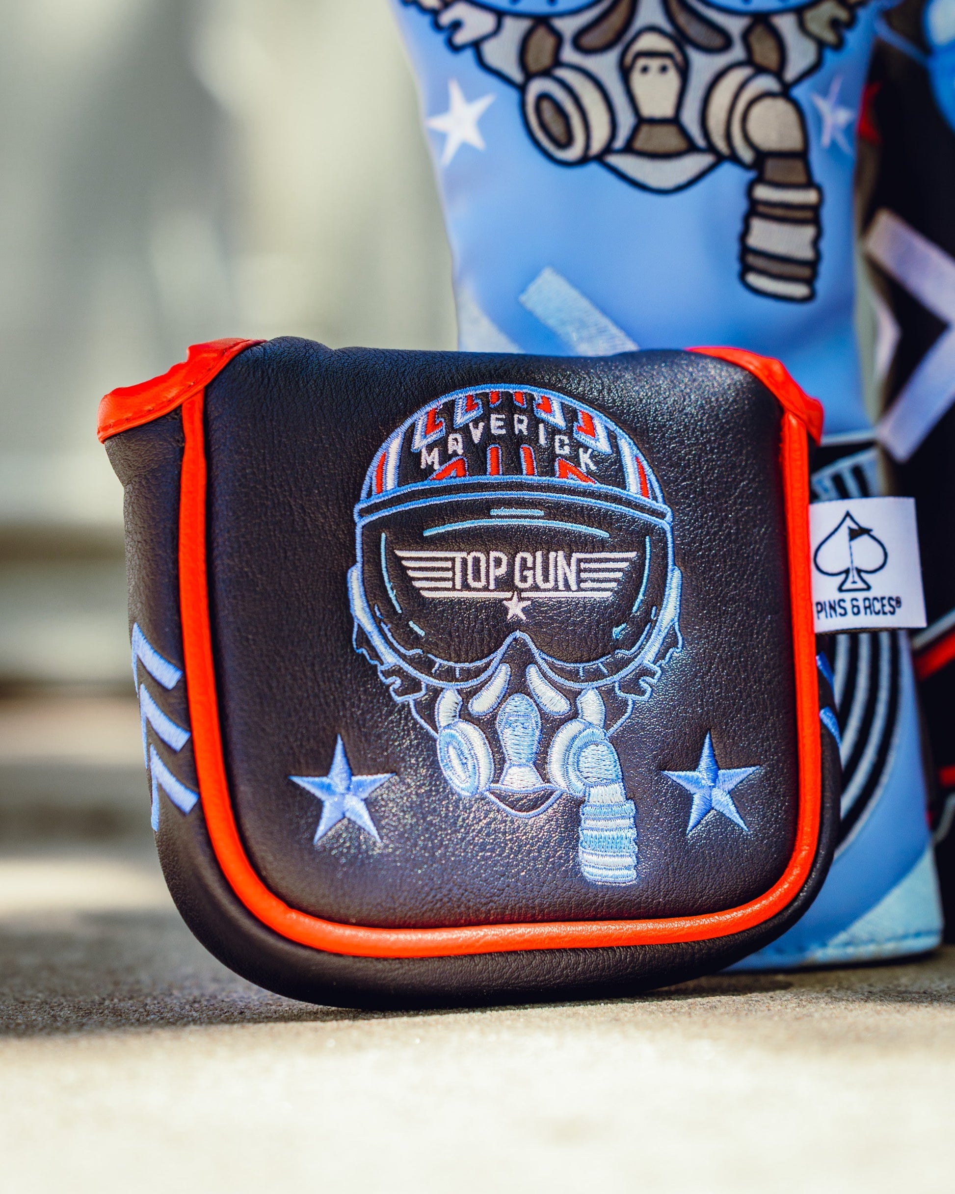 Top Gun Maverick themed golf mallet headcover with skull and aviator goggles design, featuring patriotic stars and red trim.