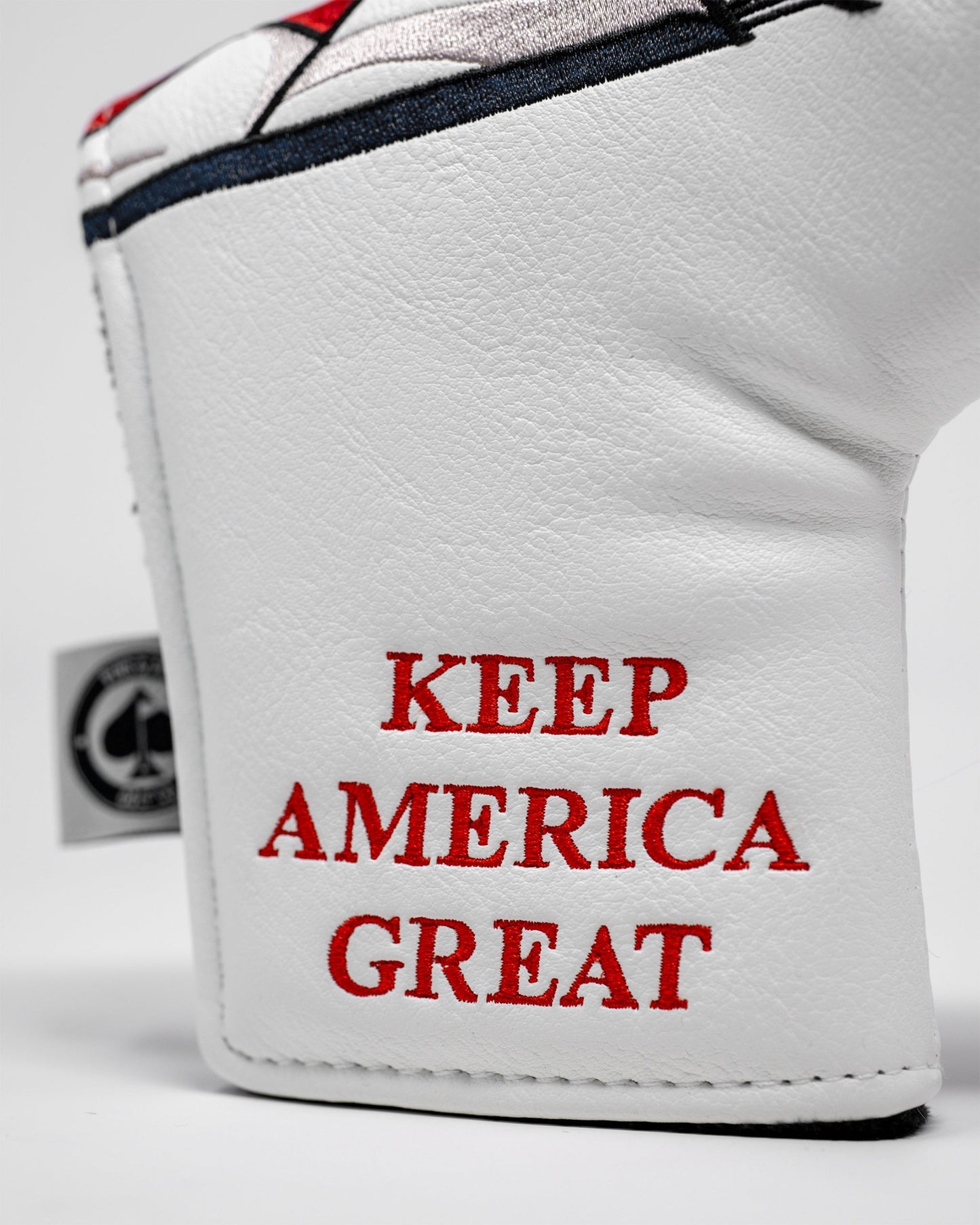 Trump Blade Putter Cover featuring a vibrant design of Donald Trump's face, ideal for golf enthusiasts.