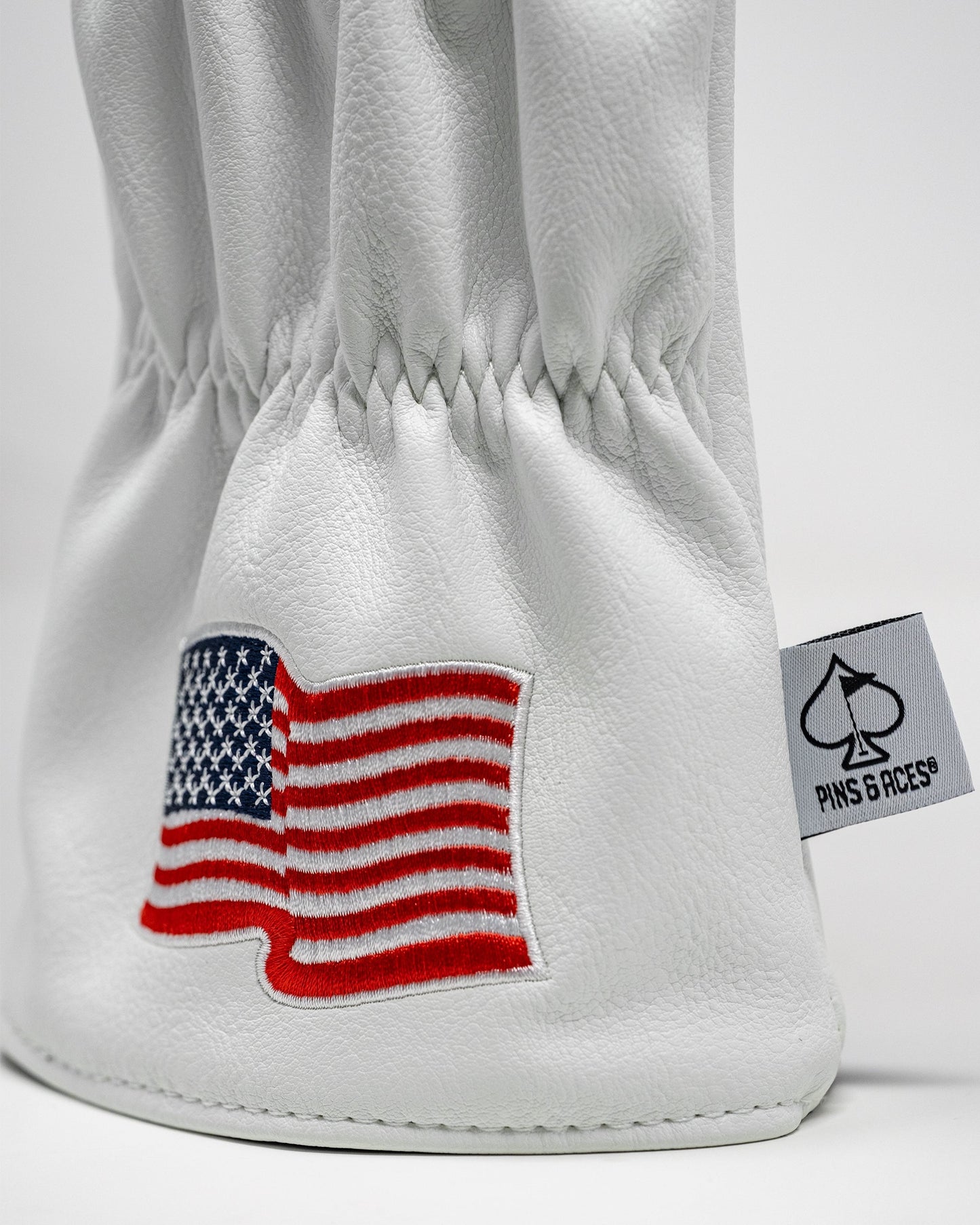 Trump-themed golf driver head cover featuring a caricature of Donald Trump's face.