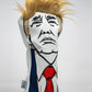 Trump driver head cover with a bold design featuring the former president's likeness, perfect for golf enthusiasts.