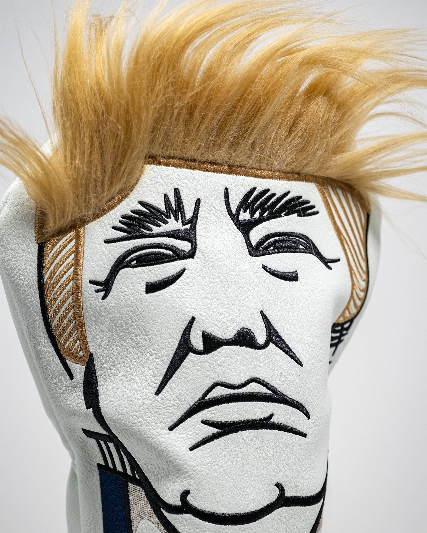 "Trump-themed driver cover featuring a caricature of Donald Trump, designed for golf clubs."
