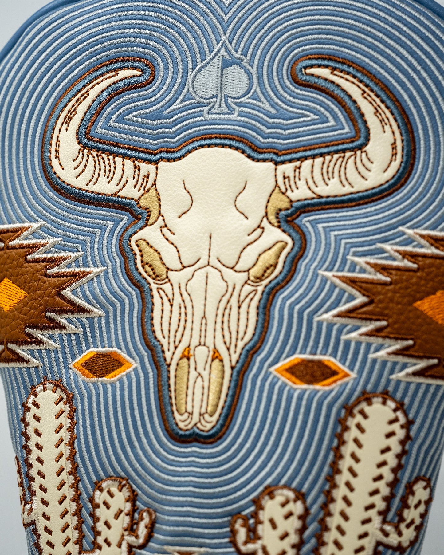 Western aesthetic driver cover featuring rustic cowboy motifs and leather-like texture, perfect for golf enthusiasts.