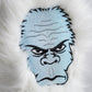 Yeti driver head cover featuring a playful yeti design with vibrant colors and a textured finish.