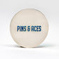 Cool Mint ball marker featuring "PINS & ACES" in bold blue lettering on a sleek silver surface.