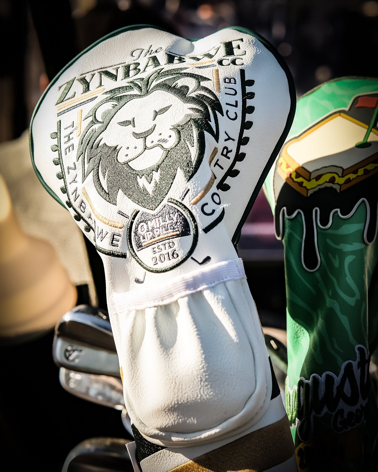 Zynbabwe Country Club driver cover with a stylish design featuring vibrant colors and a logo, ideal for golf enthusiasts.