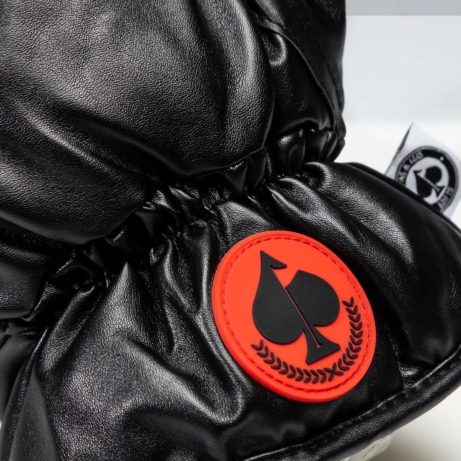 Black boxing glove driver cover, designed for golf clubs, featuring a sleek and stylish finish.