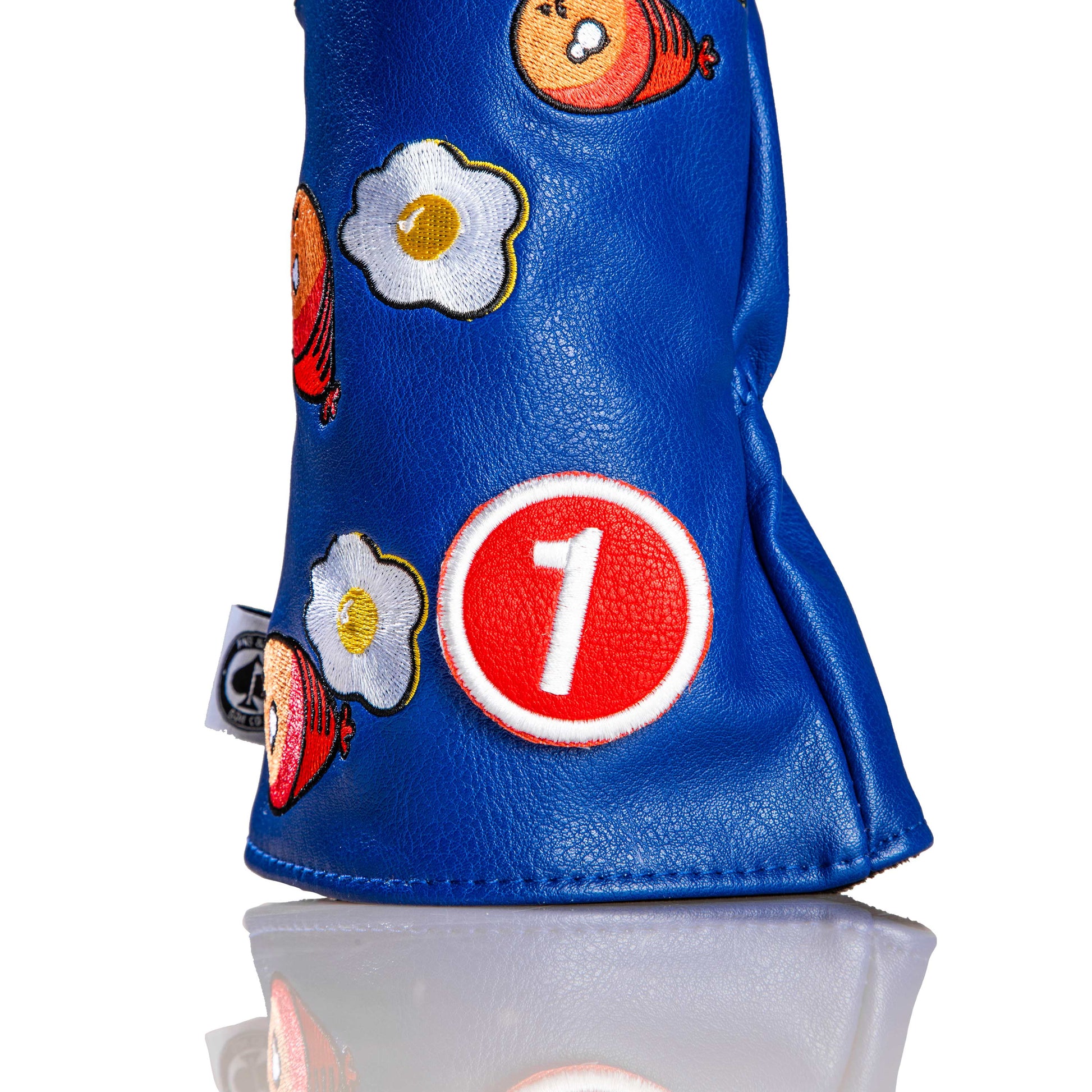 Ham and Eggs driver cover featuring a playful design with vibrant colors and detailed graphics of ham and eggs.